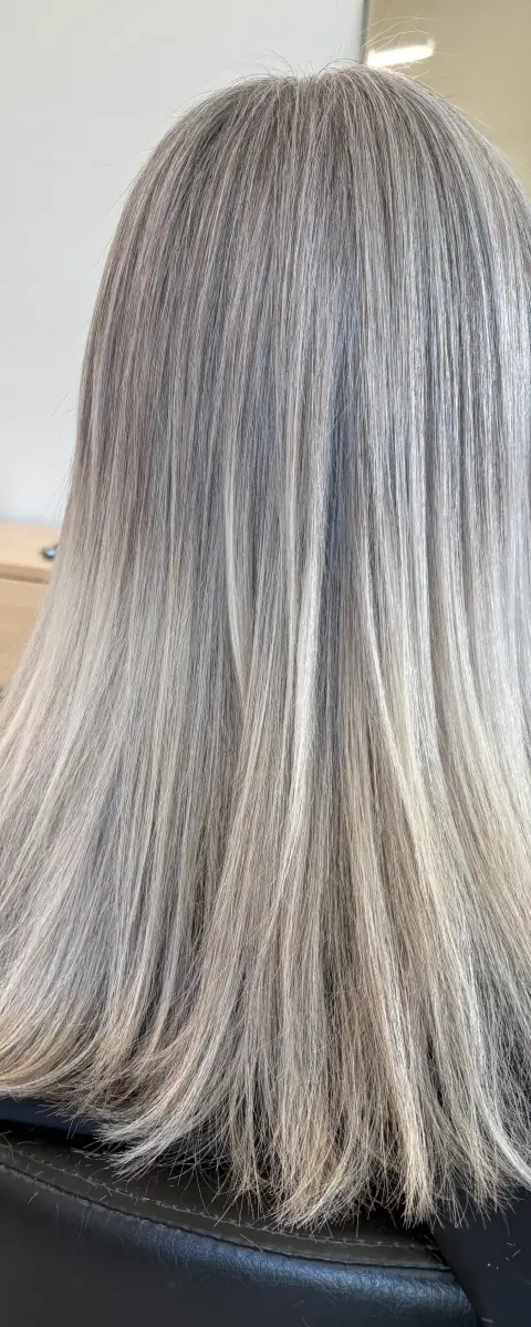Straight cool blonde hair with icy platinum and ash tones.